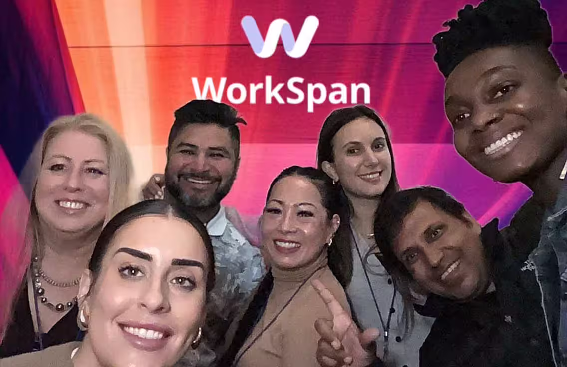 Group of seven smiling diverse coworkers posing in front of a colorful WorkSpan logo background.